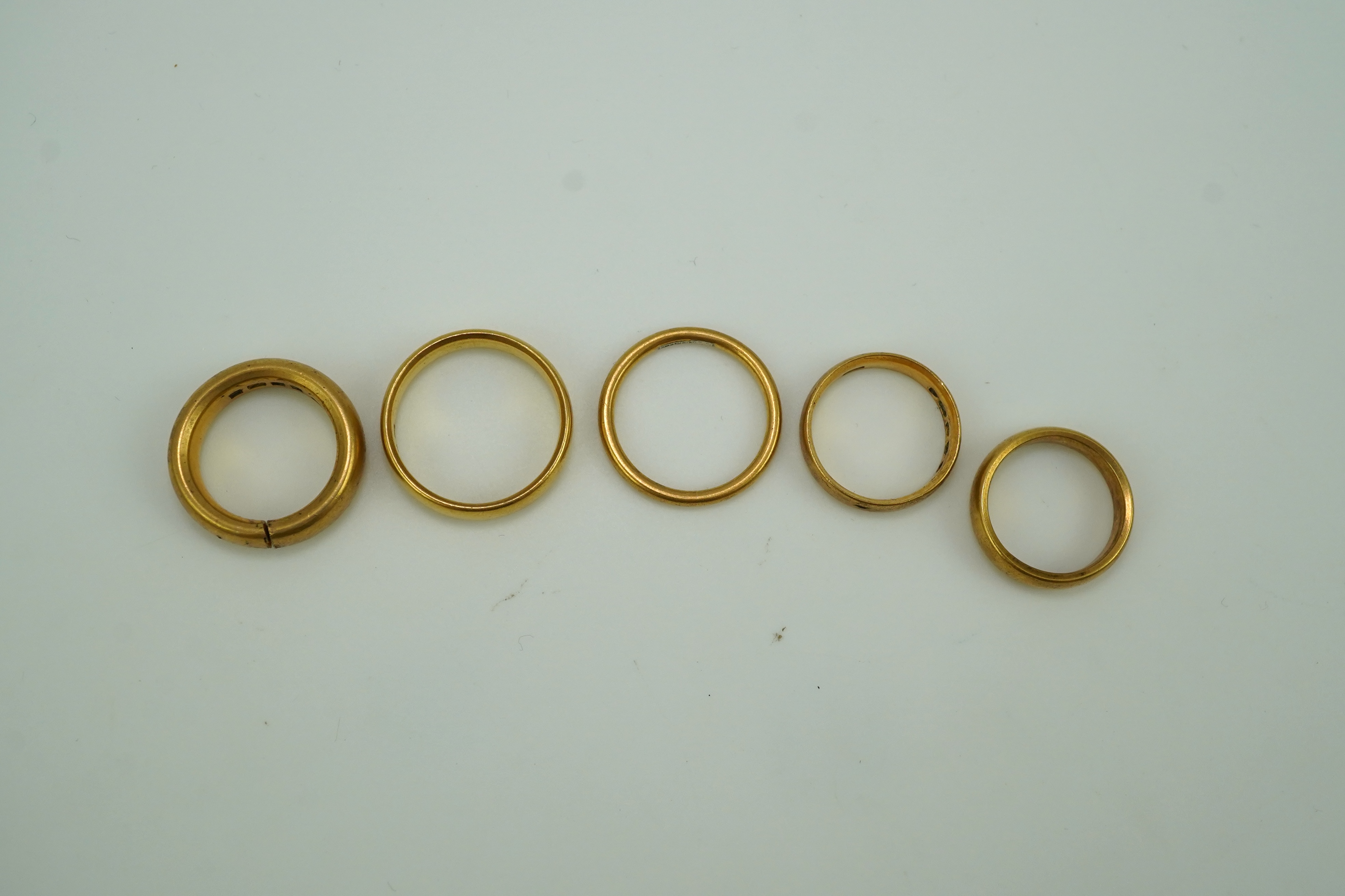 Five 22ct gold wedding bands